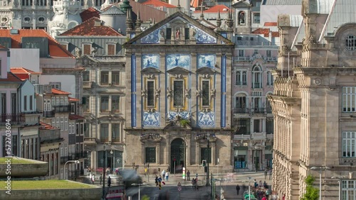 Almeida Garret Square with the Sao Bento railway station and Congregados Church at the back timelapse, Porto, Portugal. Traffic on intersection in front of the building photo