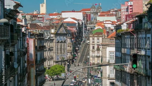 Aerial view of the Almeida Garret Square with the Sao Bento railway station and Congregados Church and Saint Ildefonso at the back timelapse, Porto, Portugal. Traffic on a busy street photo