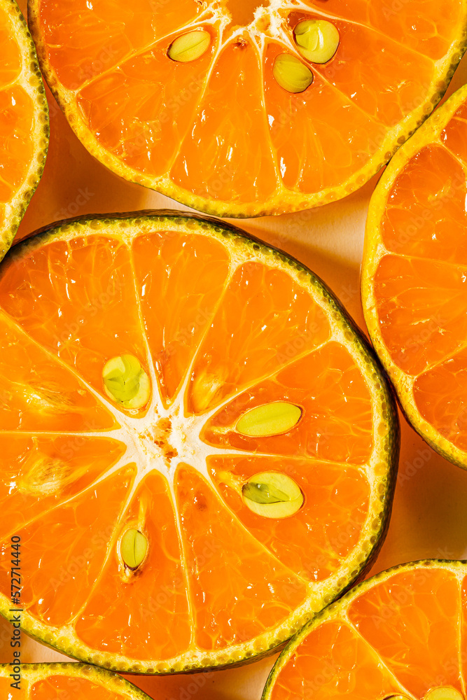 macro orange,Background made with stacks of sliced oranges macro orange,Background made with stacks of sliced oranges