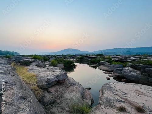 The scene of nature with canyon, river and mountain. A landscape of Khong river in Ubon Ratchathani province. View in the morning. © Lalida