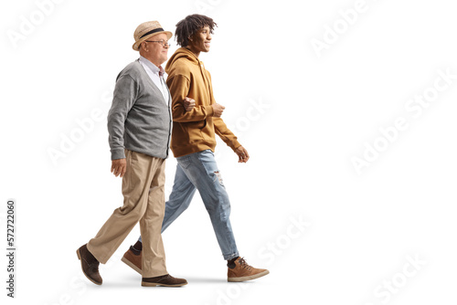 Young african american man walking with a senior caucasian man