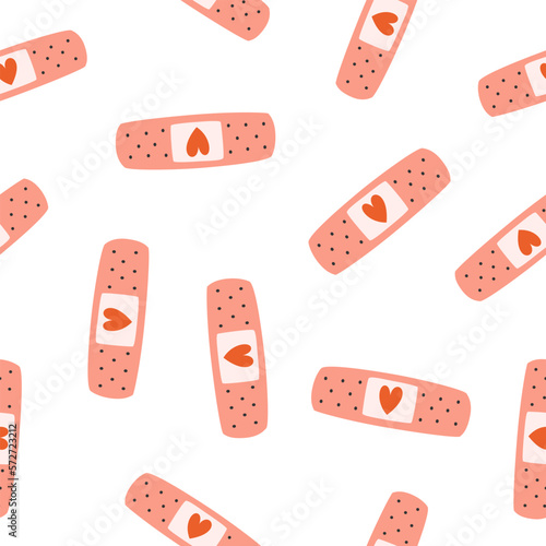 Hand drawn cute seamless pattern of adhesive plaster with heart. Flat vector transfusion and blood donation print design in doodle style. Medicine concept. Repeated background, wrapping or wallpaper. photo