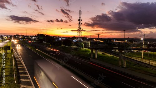 Marilia  Sao Paulo  Brazil  January 26  2023. traffic on the Highway and silhouette of a telecommunications antenna in Marilia city  during a sunset