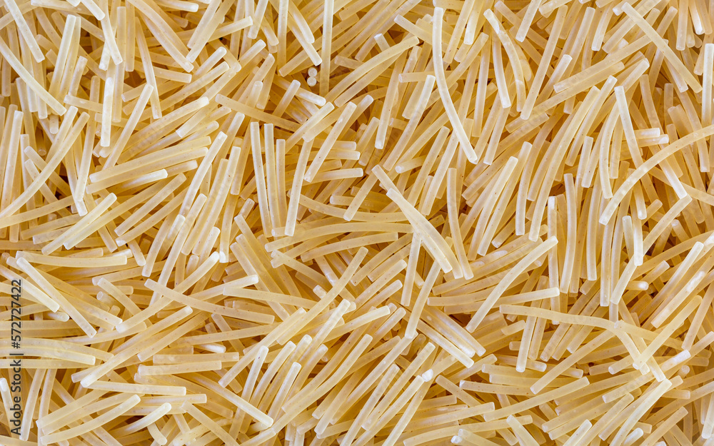 Short noodles texture background, top view, macro Short noodles texture background, top view, macro