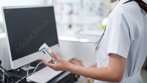 Asian woman pharmacist working at Pharmacy Drugstore  . Medical healthcare concept