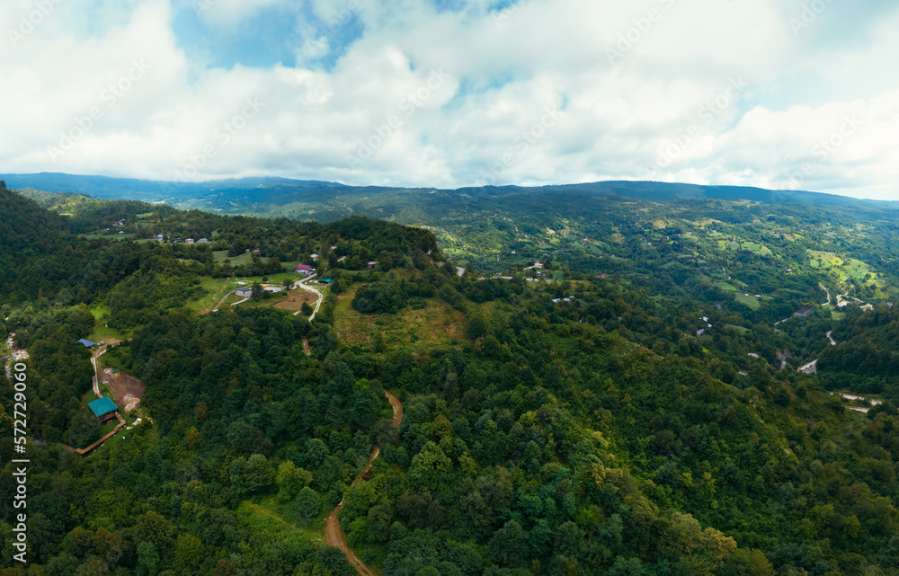 Obraz premium Panorama of an enormous Kinchkha waterfall on Okatse Canyon, near Kutaisi, Georgia, aerial view. cloudy summer day. Kinchkhaperdi