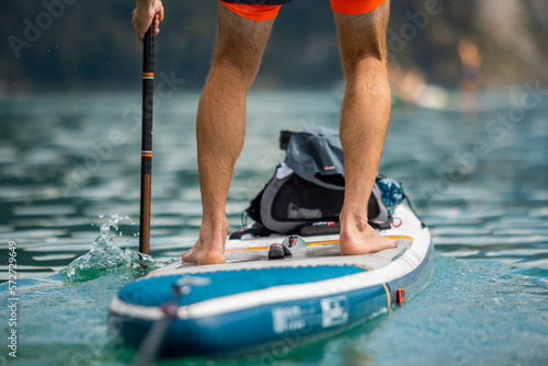 Man Paddling with an Inflatable SUP Stand-Up Paddle Board
