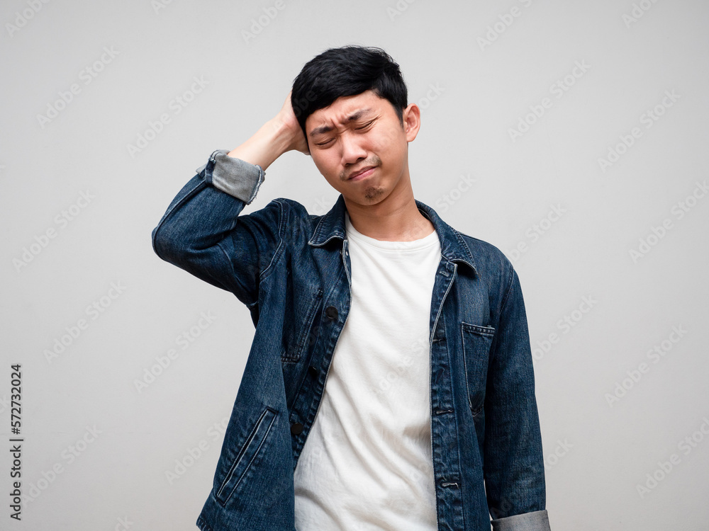 Sadness asian man jeans shirt feels disheartened,cry,headache isolated Sadness asian man jeans shirt feels disheartened,cry,headache isolated