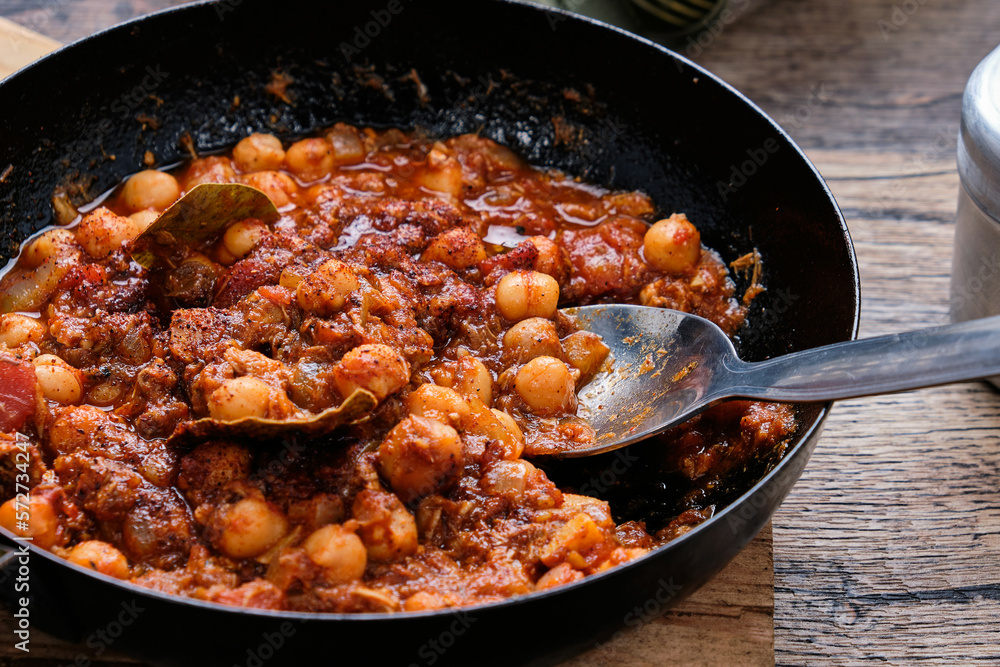 Camping chili con carne on a wooden table. Camping chili con carne on a wooden table.