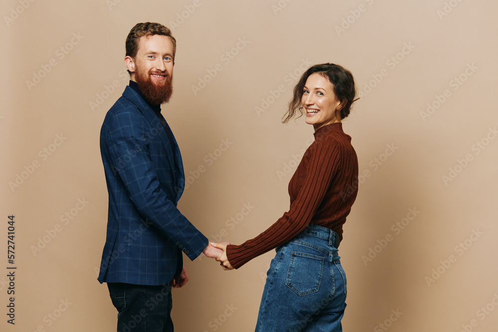 Man and woman couple in a relationship smile and interaction on a beige background in a real relationship between people Man and woman couple in a relationship smile and interaction on a beige background in a real relationship between people
