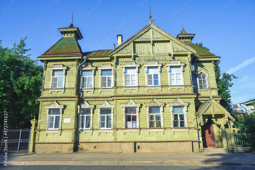 Fototapeta premium old wooden mansion in the form of a terem, Russian wooden architecture, Russia, Kostroma, sunny summer day