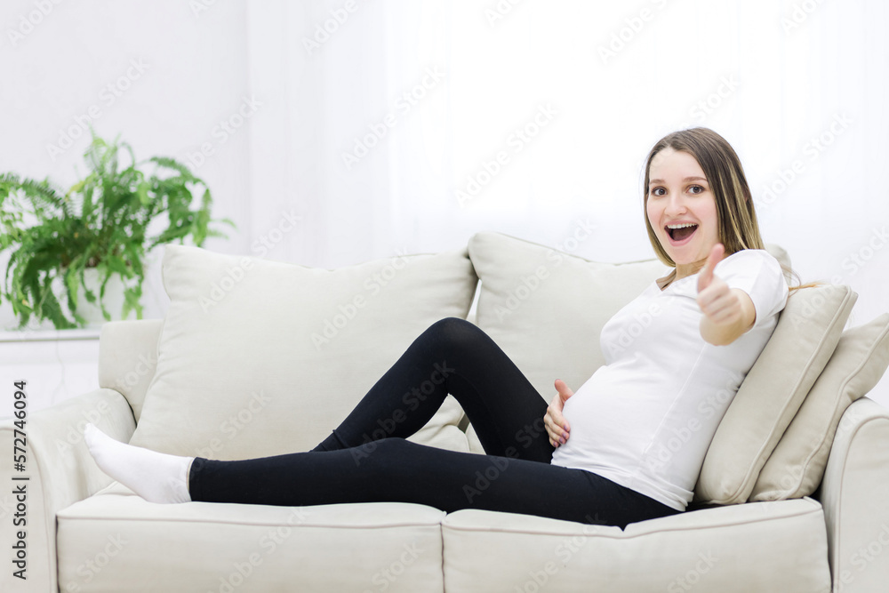 Smilling pregnant woman showing thumb up. Smilling pregnant woman showing thumb up.