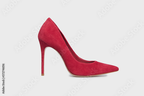 Red pointy toe women's shoe with high heels isolated on white background. Female classic stiletto heels in suede leather. Single. Mock up, template