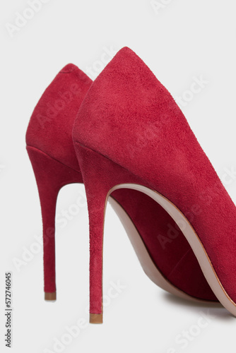 High heels stilettos women's shoes isolated on white background. Female classic stiletto heels in suede leather. Red color. Mock up, template. Behind view