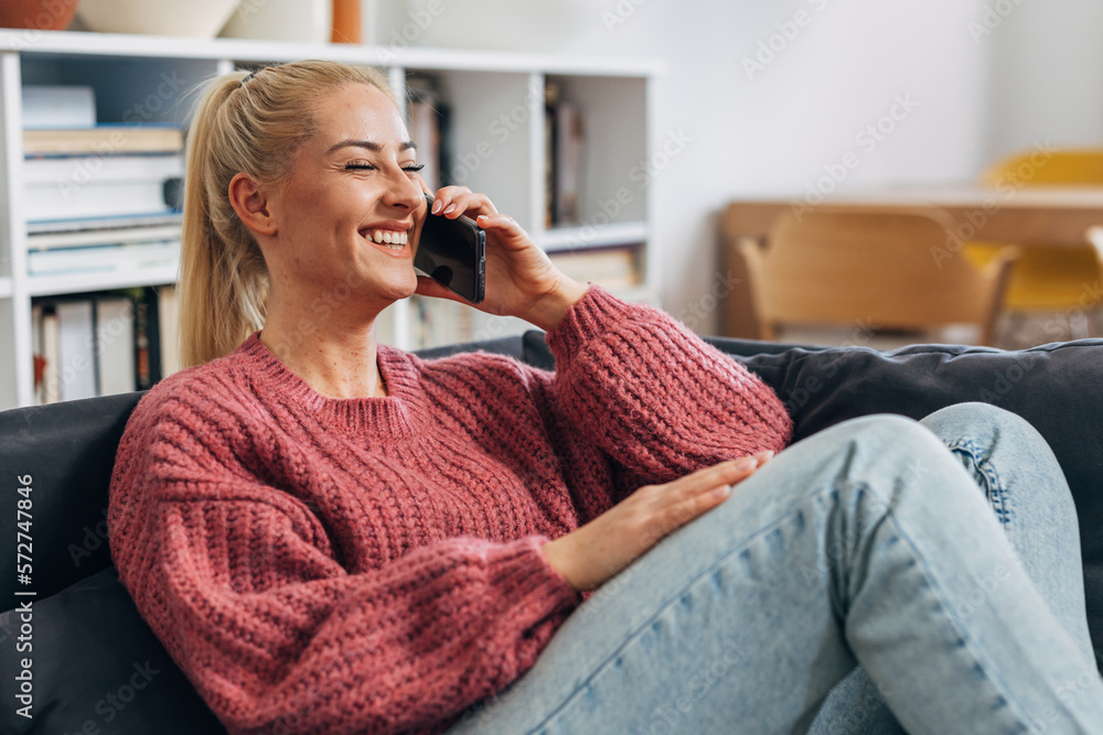 Happy woman is having a phone call with her boyfriend Happy woman is having a phone call with her boyfriend