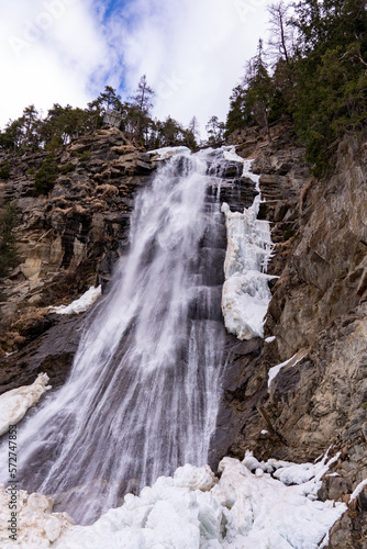 Waterfall from the bottom in the winter with ice