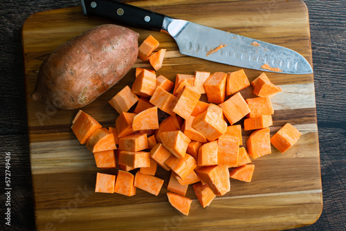 Canvas Print Peeled Sweet Potatoes Chopped Into Large Cubes: Prepped sweet potato chunks on a