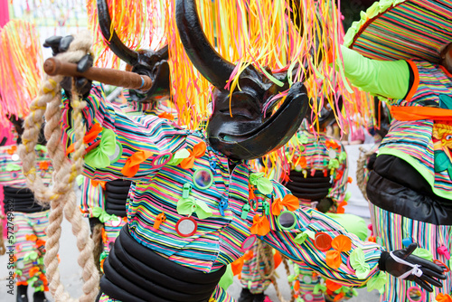 Dominican Republic Punta Cana Annual Carnival. A man in a carnival costume and mask. photo