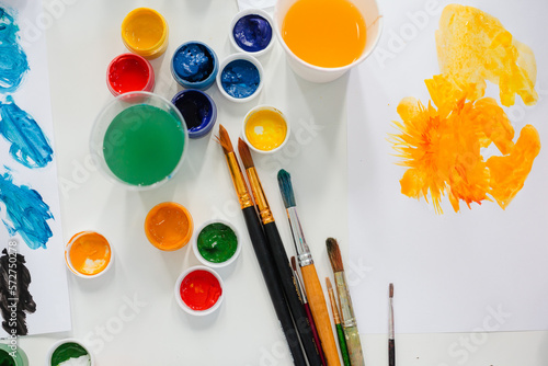 Top view of artist's paints and brushes