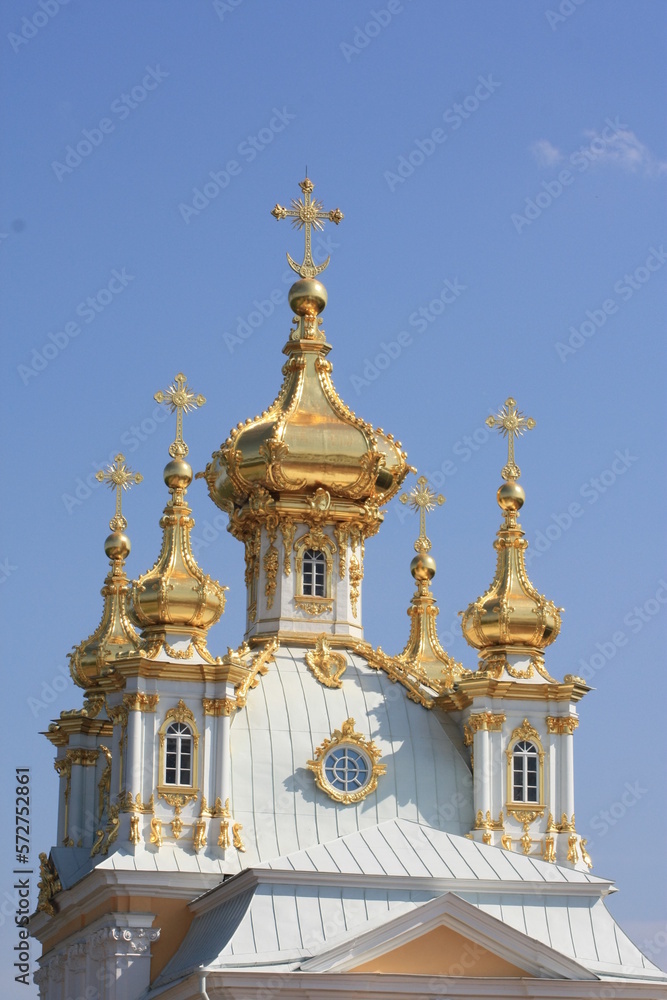 Church cross in gold color. Christian faith. Religious building, building for the worship of God. Religious tourism