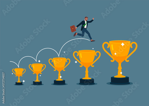 Businessman jumping from small win trophy to get bigger one. Achieve bigger goal, strategy or inspiration to success. Modern vector illustration in flat style