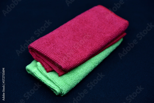 Terry towels on a dark background. Colorful wiping cloths. Terry napkins.