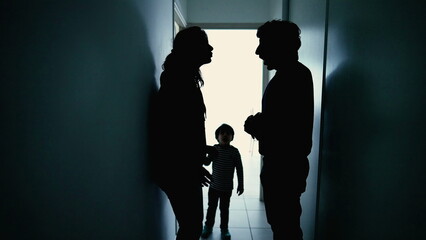 Angry parents fighting in front little boy son. Abusive relationship discussion. Husband hitting wife standing in corridor in the dark