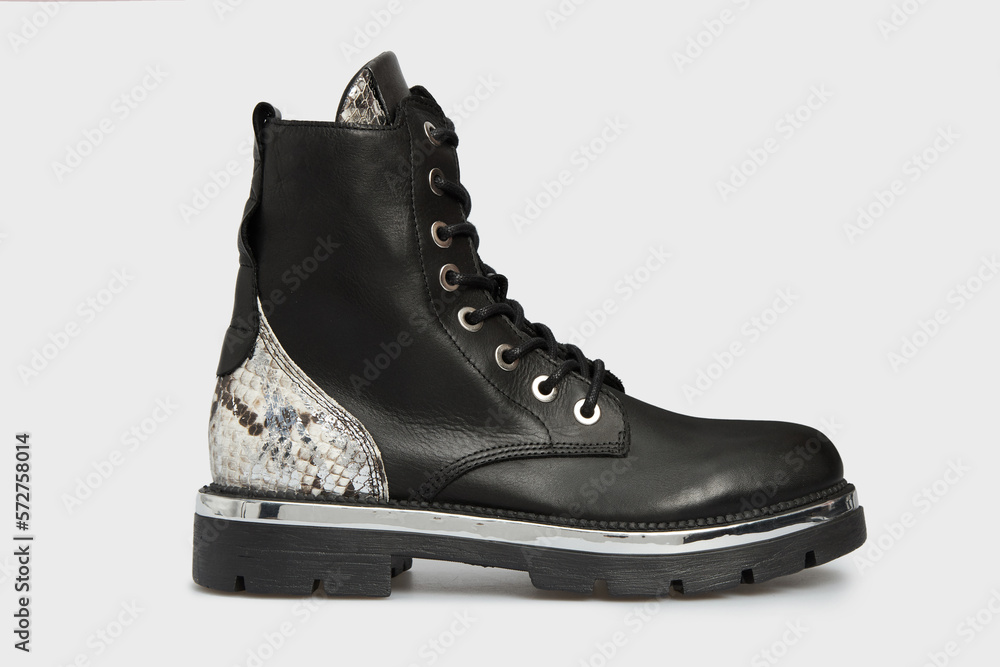 Blank black women's fashion Combat Chelsea boot isolated on white background. Female classic spring autumn shoe in snake skin leather print. Casual lace up laced footwear. Mock up, template Blank black women's fashion Combat Chelsea boot isolated on white background. Female classic spring autumn shoe in snake skin leather print. Casual lace up laced footwear. Mock up, template