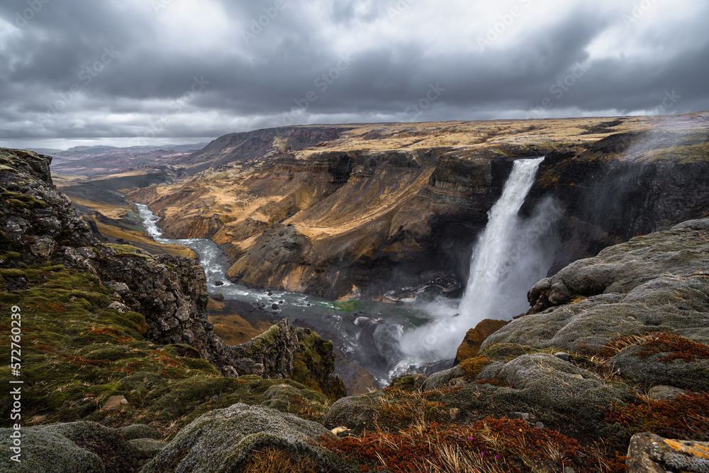 Haifoss the third highest waterfall in Iceland under dark clouds