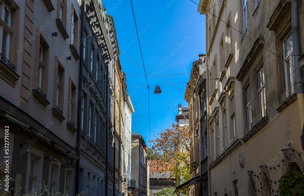Narrow street of historical part Lviv city with old vintage buildings, Ukraine