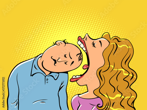 The woman opens her mouth violently and tries to eat the man's head. The husband provides for all the needs of his wife. Family life.