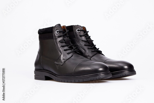 Black men's classic leather ankle boots isolated on white background. Pair of lace up business formal polished shoes for men, gentleman. Template, mock up