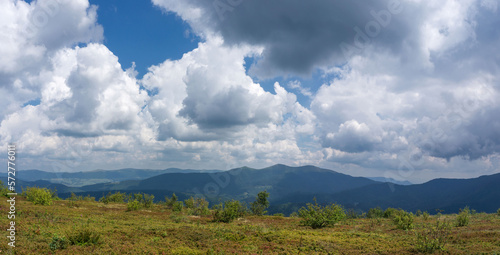 Panorama of a mountainous area with a beautiful, cloudy sky