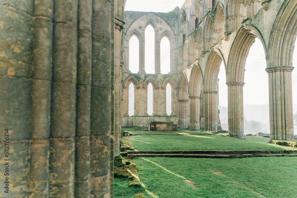 Ancient arches and pillars, part of Rievaulx Abbey in North Yorkshire. Religious monestary ruins. Ancient arches and pillars, part of Rievaulx Abbey in North Yorkshire. Religious monestary ruins.