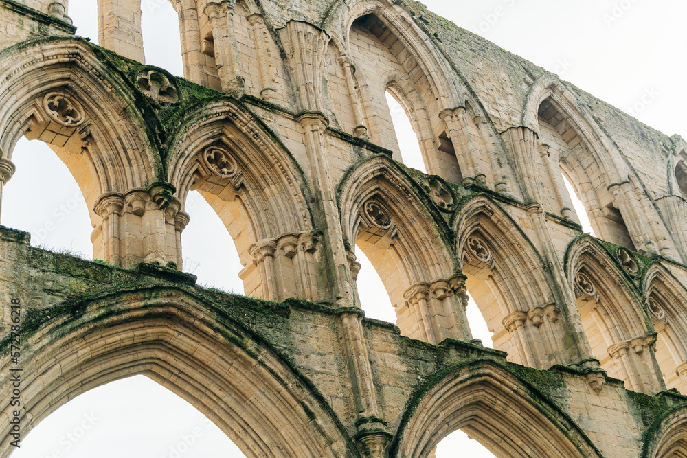 Ancient arches and pillars, part of Rievaulx Abbey in North Yorkshire. Religious monestary ruins.