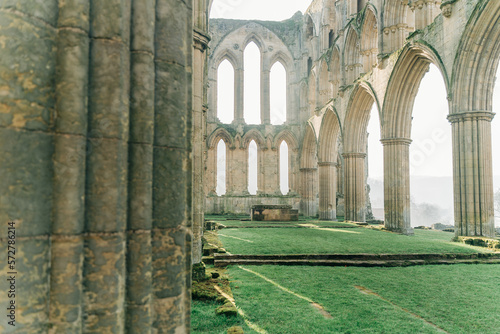 Ancient arches and pillars, part of Rievaulx Abbey in North Yorkshire. Religious monestary ruins.