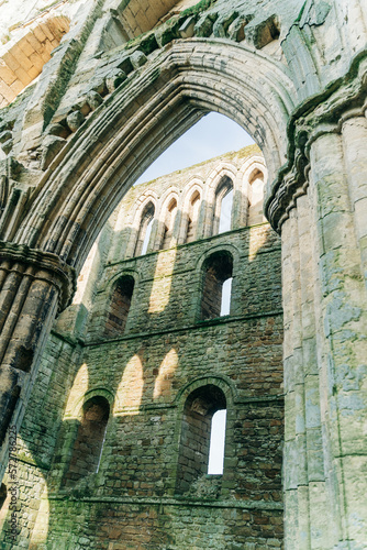 Ancient arches and pillars, part of Rievaulx Abbey in North Yorkshire. Religious monestary ruins.