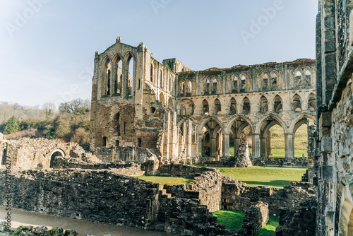 Ancient arches and pillars, part of Rievaulx Abbey in North Yorkshire. Religious monestary ruins.