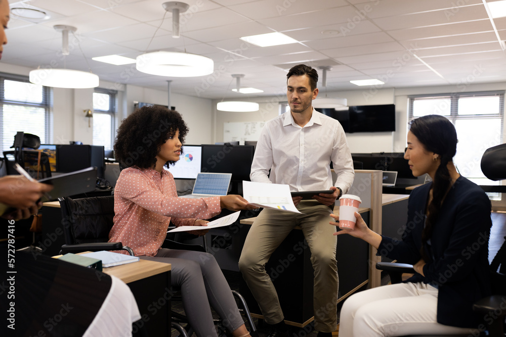Group of diverse people in office working with documents Group of diverse people in office working with documents