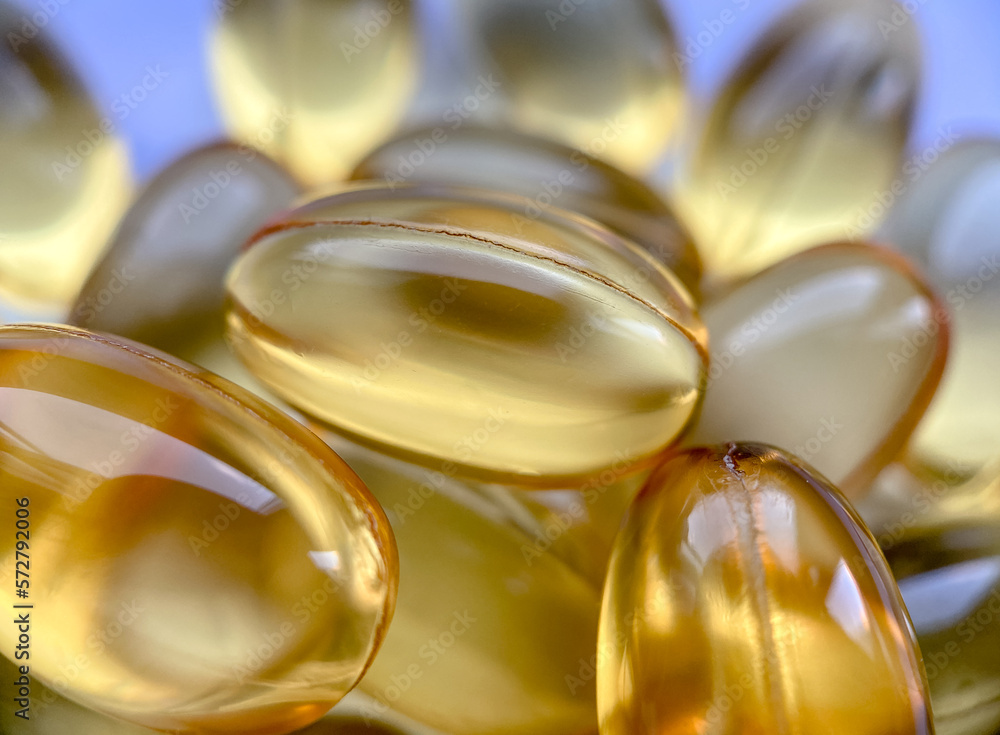 Close-up omega-3 capsules. Polyunsaturated fatty acids. The concept of a healthy lifestyle. Great for magazines and websites in the style of healthy, as well as in medicine Close-up omega-3 capsules. Polyunsaturated fatty acids. The concept of a healthy lifestyle. Great for magazines and websites in the style of healthy, as well as in medicine