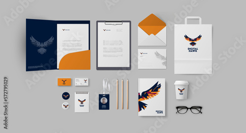 Corporate branding in blue and orange colors with minimal eagle logo for traveling company or digital studio, stationery set ready for use and printing