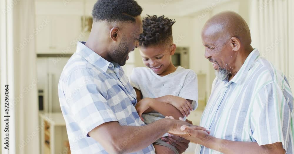 Happy african american son, father and grandfather laughing, slow motion Happy african american son, father and grandfather laughing, slow motion