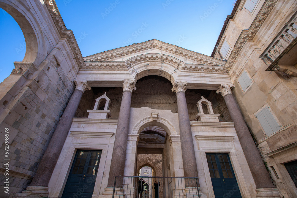 Marble roman architecture in city center of town Split, view at square Peristil in front of cathedral Saint Domnius and bell tower landmarks, Croatia.