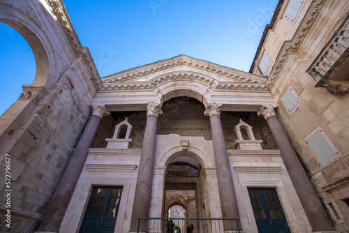 Marble roman architecture in city center of town Split, view at square Peristil in front of cathedral Saint Domnius and bell tower landmarks, Croatia.