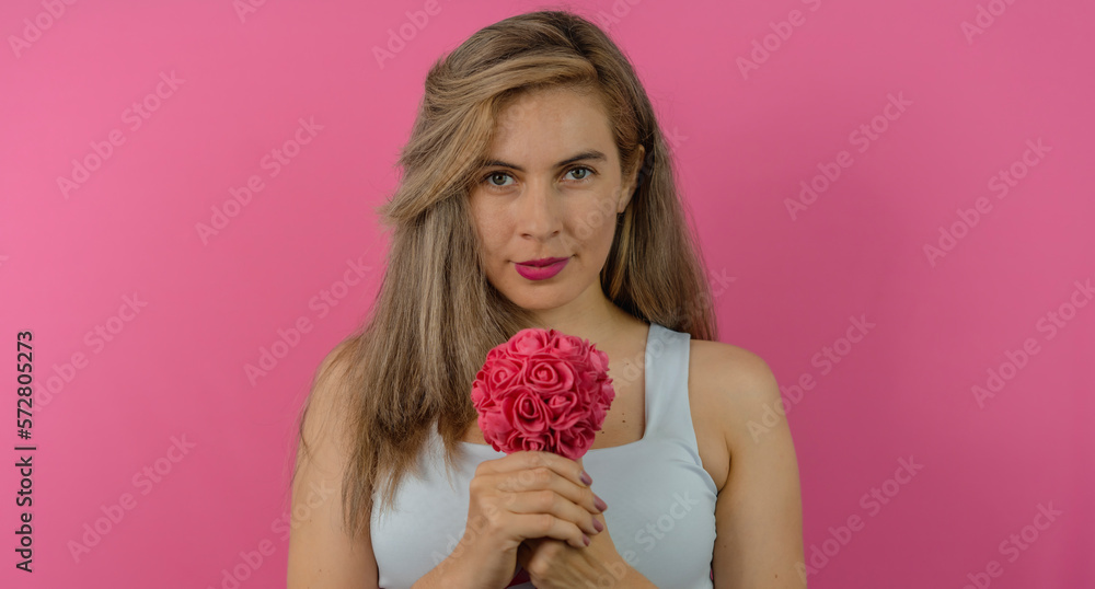beautiful woman with golden hair, uncomplicated, with a sunflower in her hand enjoying the day celebrating the day of the very happy woman beautiful woman with golden hair, uncomplicated, with a sunflower in her hand enjoying the day celebrating the day of the very happy woman