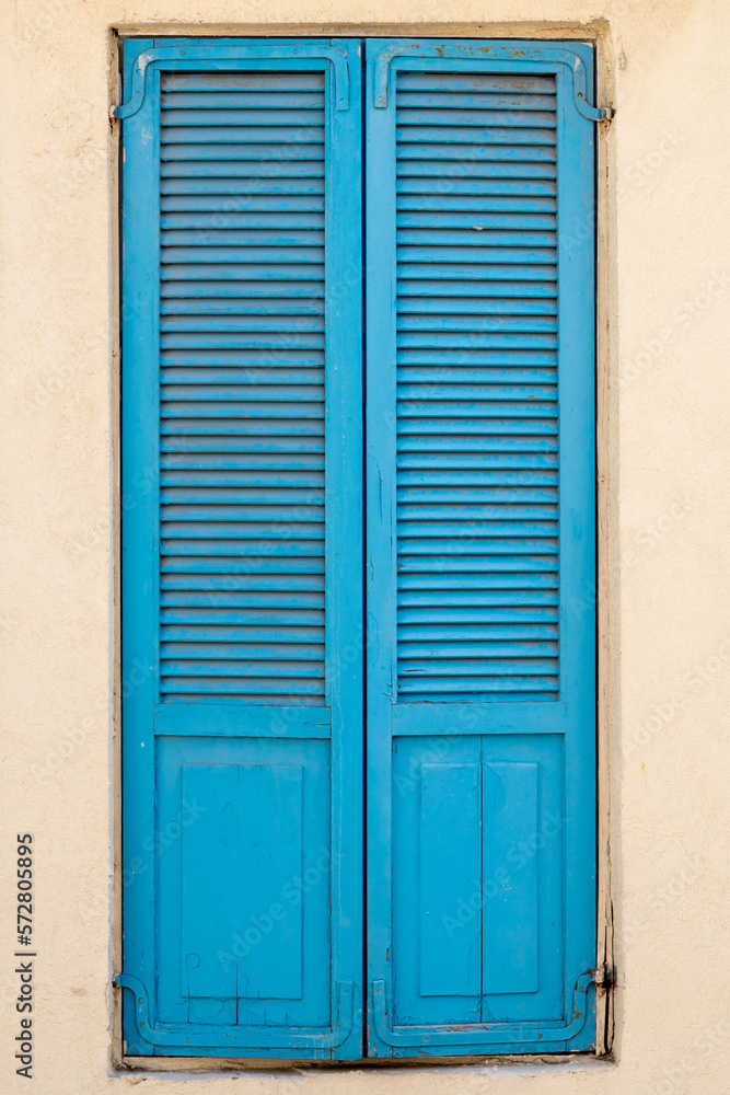 Vintage blue wooden shutters on a window