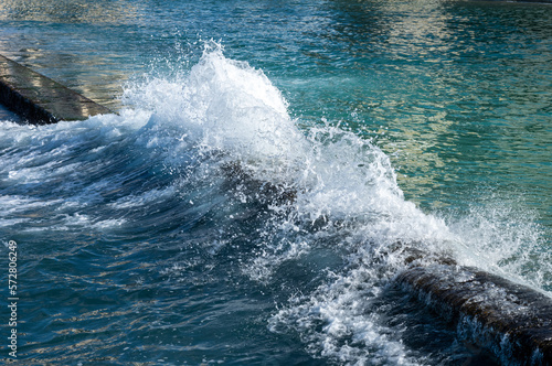 Wave Breaking on the Break Wall Protecting Waikiki Swimmers.