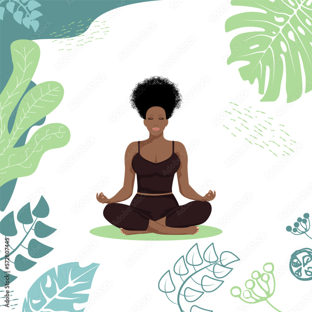 A beautiful African American girl sits in the lotus position among tropical leaves. A healthy way of life.