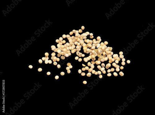 Soy Bean flying explosion, yellow grain beans explode abstract cloud fly. Beautiful complete seed pea soy bean splash in air, food object design. Selective focus freeze shot black background isolated