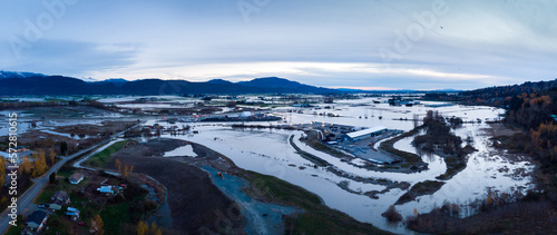 Aerial view of Fraser Valley farmers fields flooded from torrential rains, climate change effect, natural disaster, intense flooding, British Columbia. photo